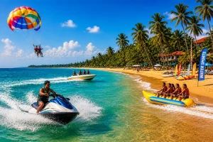 Bentota beach Sri Lanka with water sports, golden sand and palm trees