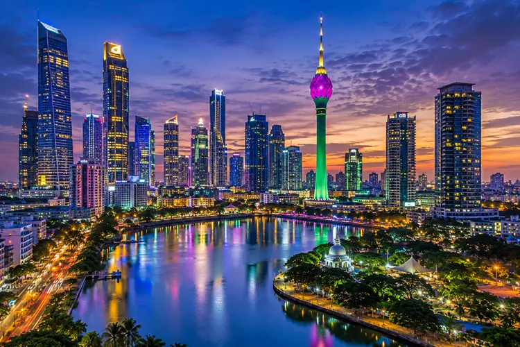 Colombo city skyline with Lotus Tower and modern skyscrapers at sunset in Sri Lanka